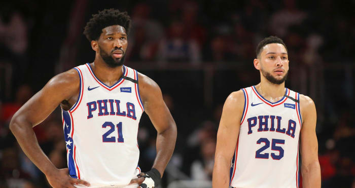 Philadelphia 76ers center Joel Embiid (21) and guard Ben Simmons (25) during a free throw against the Atlanta Hawks in the second quarter at State Farm Arena.